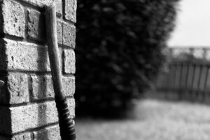 broom against wall, broom